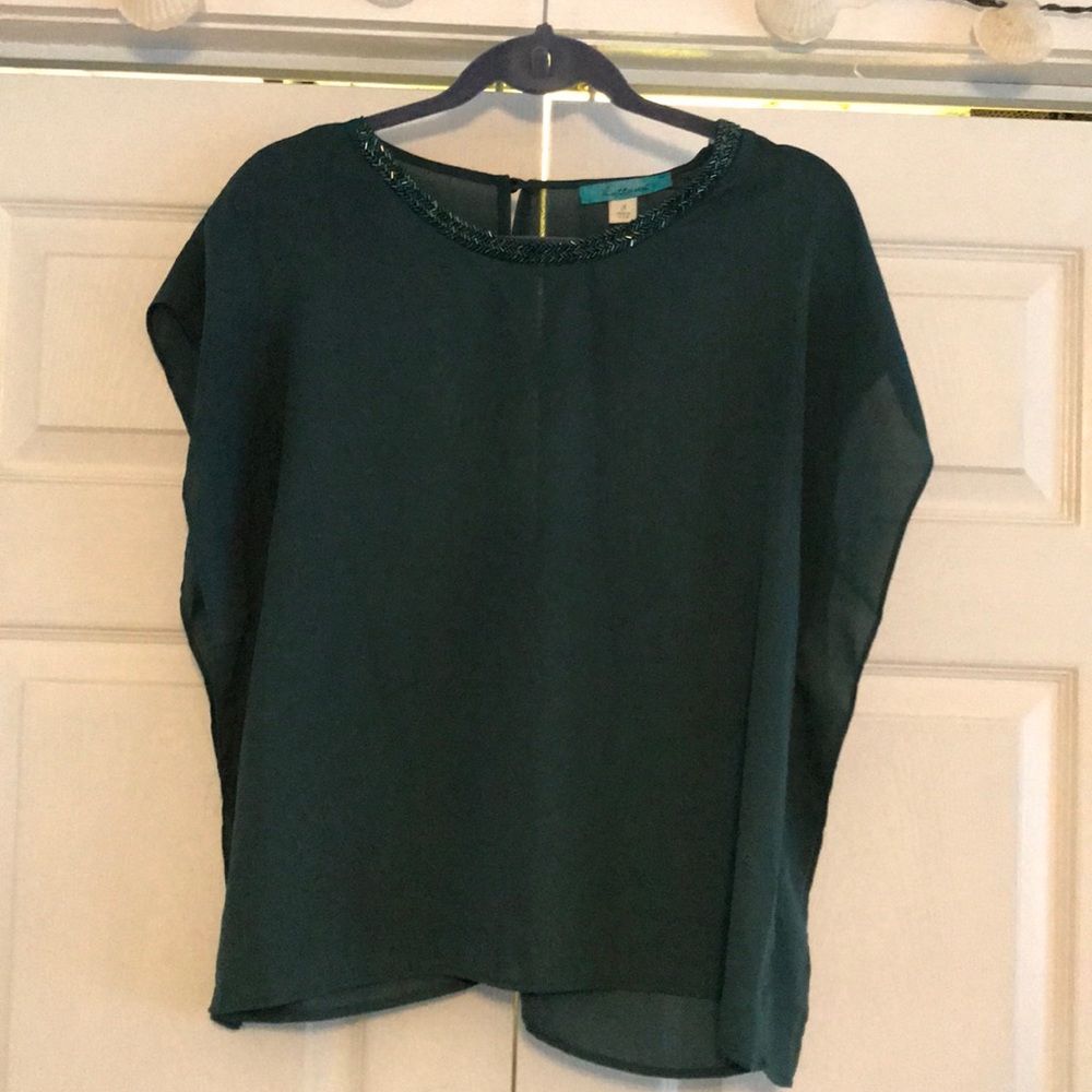 Francessca’s sleeveless sheer top